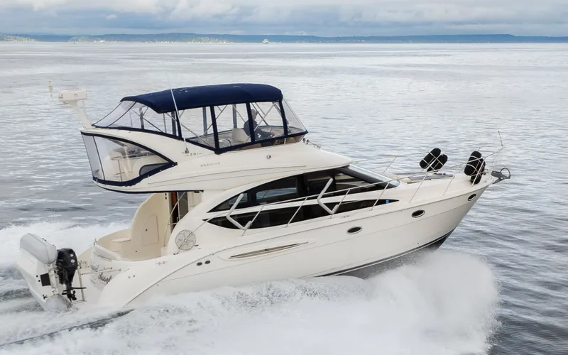 Slide: The Image of 2008 Meridian 391 Sedan cruising on open water, showcasing sleek design and luxury features. - 45