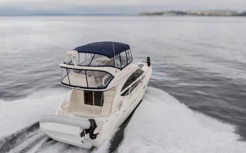 Slide: The Image of 2008 Meridian 391 Sedan cruising on open water, showcasing sleek design and powerful performance. - 46