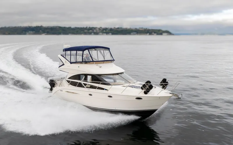 Slide: The Image of 2008 Meridian 391 Sedan cruising on open water, showcasing sleek design and performance. - 5