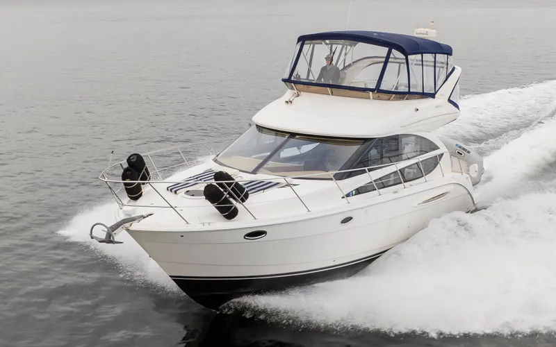 Slide: The Image of 2008 Meridian 391 Sedan cruising on open water, showcasing sleek design and performance. - 6