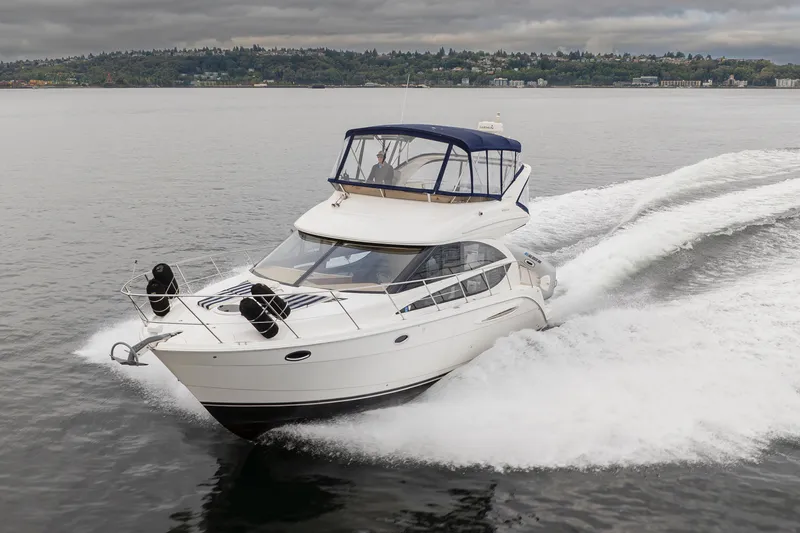 Slide: The Image of 2008 Meridian 391 Sedan cruising on a calm lake under cloudy skies. - 7