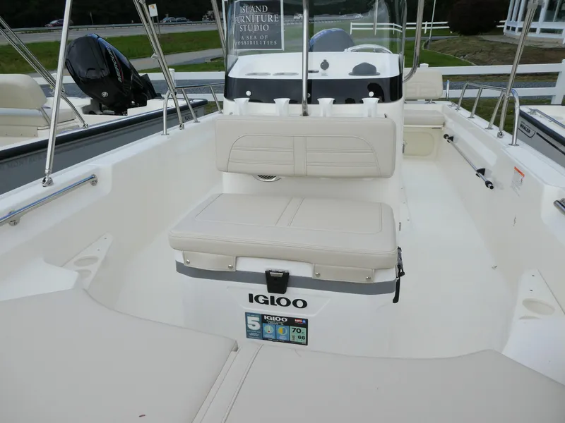 Slide: The Image of 2025 Boston Whaler 170 Montauk boat interior with seating and Igloo cooler. - 9