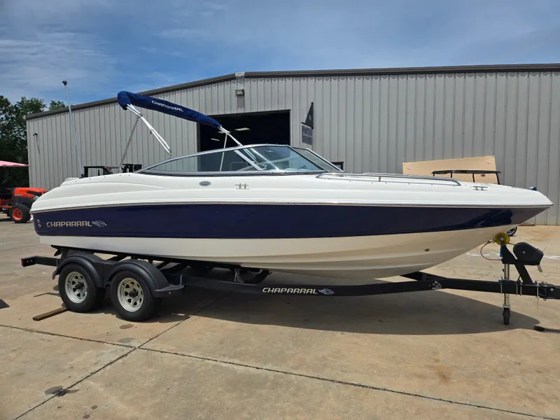 Slide: The Image of 2007 Chaparral 210 SSi boat on trailer, parked outside a warehouse. - 0