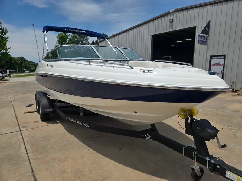 Slide: The Image of 2007 Chaparral 210 SSi boat on trailer outside service building. - 1