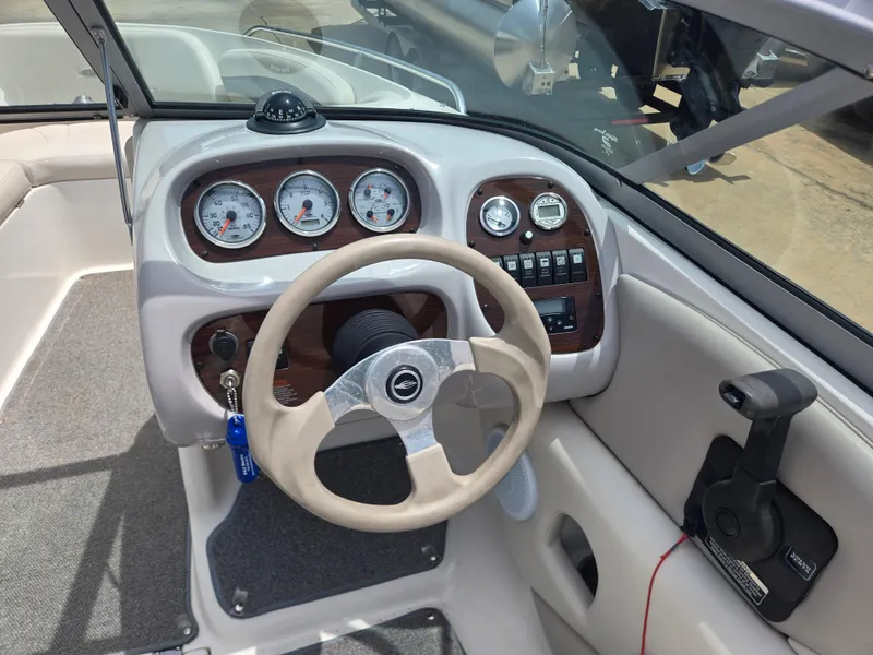 Slide: The Image of 2007 Chaparral 210 SSi boat dashboard with steering wheel and instrument panel. - 11