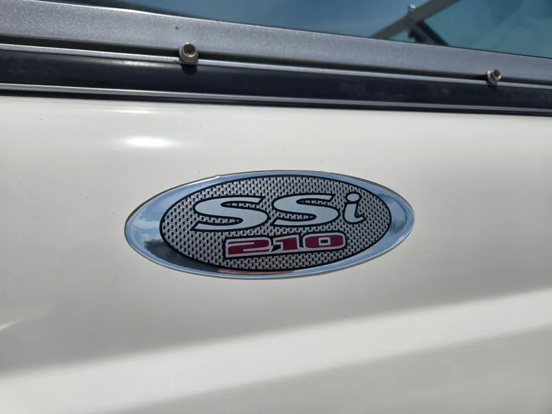 Slide: The Image of 2007 Chaparral 210 SSi logo on white boat exterior. - 12
