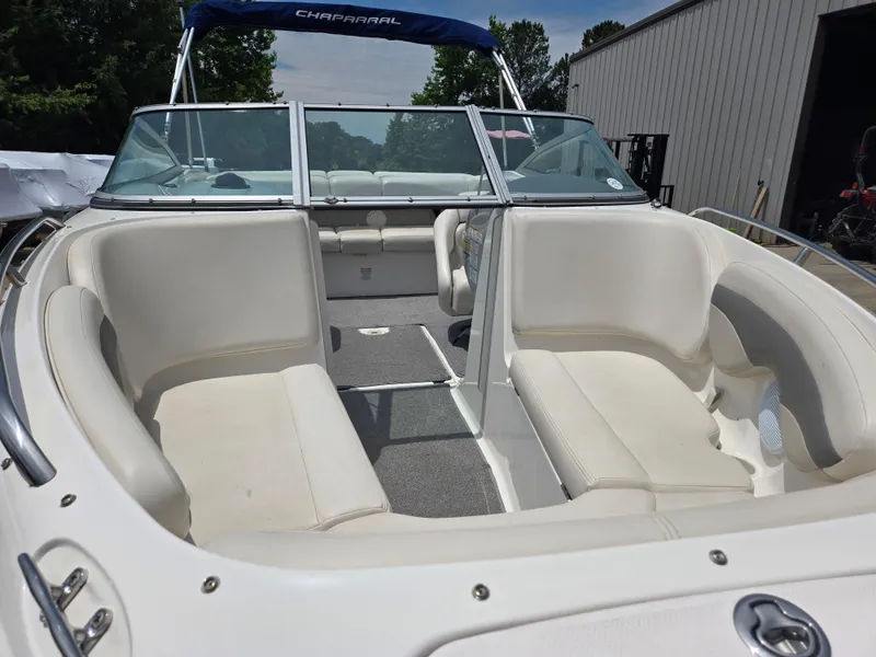 Slide: The Image of 2007 Chaparral 210 SSi boat interior with white seating and open bow design. - 13