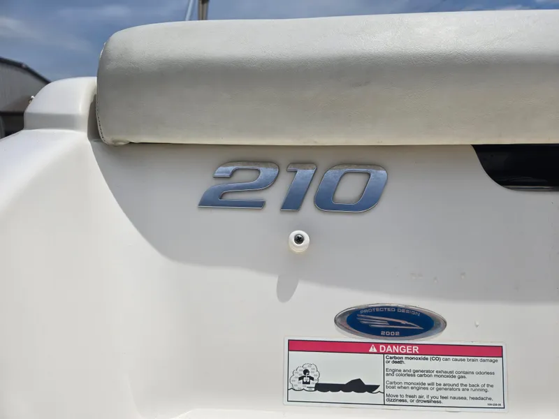 Slide: The Image of 2007 Chaparral 210 SSi boat emblem and safety warning label. - 16