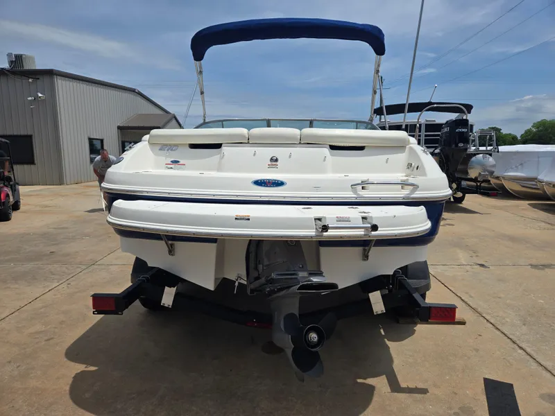Slide: The Image of Rear view of a 2007 Chaparral 210 SSi boat with blue canopy. - 17