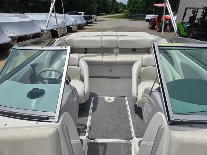 Slide: The Image of 2007 Chaparral 210 SSi boat interior with white seating and dual windshields. - 6