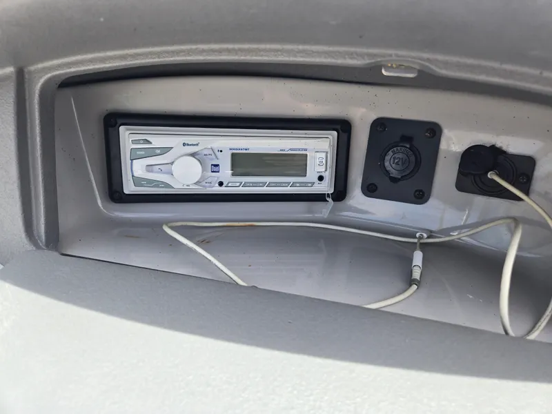 Slide: The Image of 2007 Chaparral 210 SSi boat dashboard with stereo system and wiring. - 7