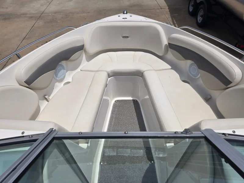 Slide: The Image of 2007 Chaparral 210 SSi boat interior with white cushioned seating and speakers. - 9