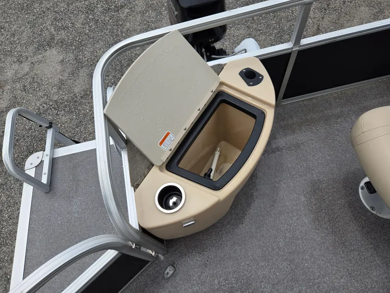 Slide: The Image of 2016 Sun Tracker Bass Buggy 18 DLX boat interior with storage compartment and seating. - 11