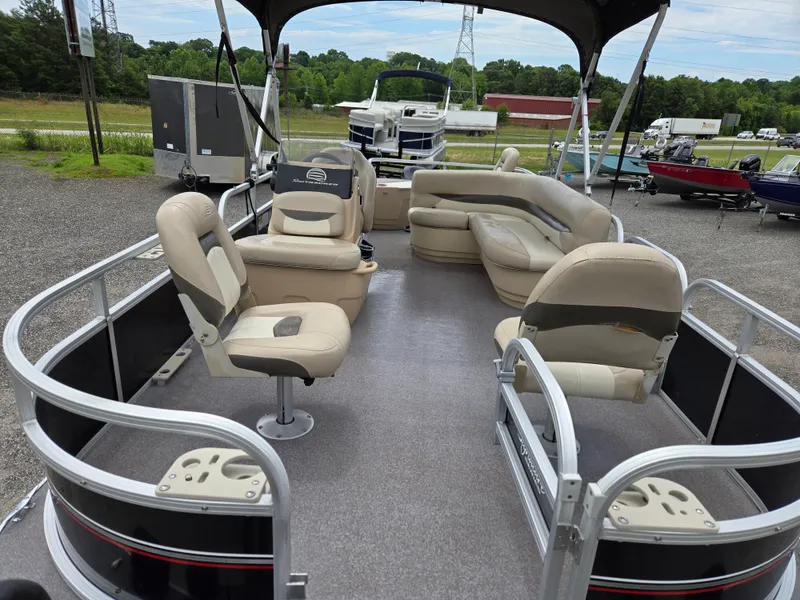 Slide: The Image of 2016 Sun Tracker Bass Buggy 18 DLX pontoon boat with spacious seating and canopy. - 14