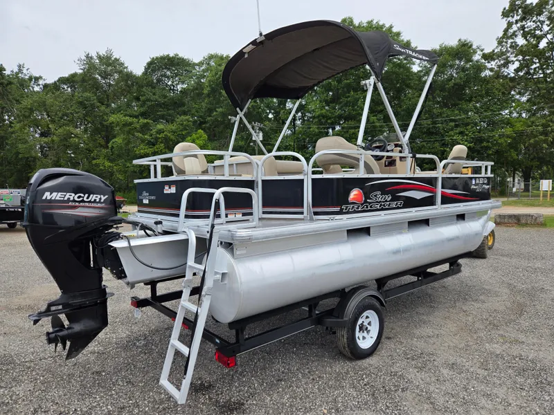 Slide: The Image of 2016 Sun Tracker Bass Buggy 18 DLX pontoon boat with Mercury outboard motor and canopy. - 4