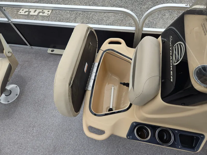 Slide: The Image of 2016 Sun Tracker Bass Buggy 18 DLX boat seat with storage compartment open. - 8