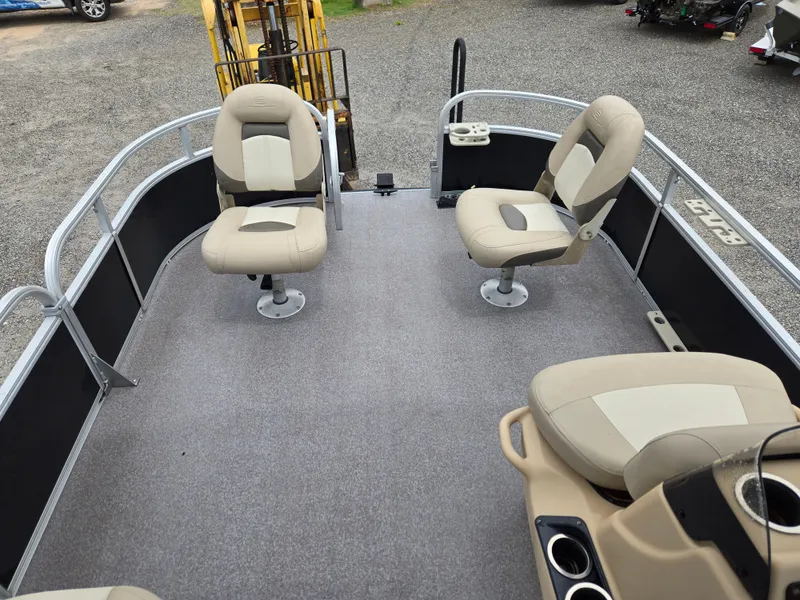 Slide: The Image of 2016 Sun Tracker Bass Buggy 18 DLX pontoon boat interior with seating and railing. - 9
