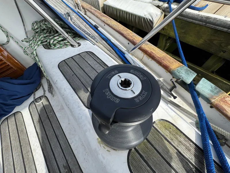 Slide: The Image of Sailboat deck with winch, ropes, and wooden accents, Passport 40, 1982 model. - 13