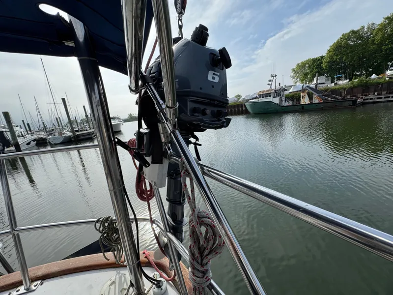 Slide: The Image of Sailboat deck view with motor, docked in a marina, Passport 40, 1982 model. - 14