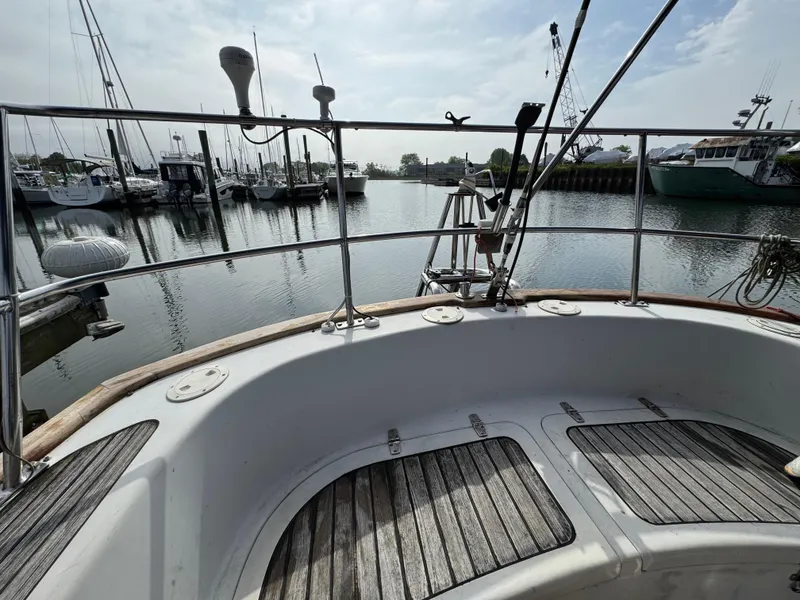 Slide: The Image of Cockpit view of 1982 Passport 40 sailboat docked in a marina. - 18