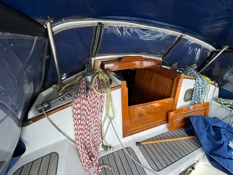 Slide: The Image of Cockpit of 1982 Passport 40 sailboat with ropes and wooden hatch. - 19