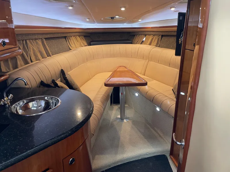 Slide: The Image of Luxurious interior of a 2004 Cobalt 360 yacht with plush seating and kitchenette. - 15