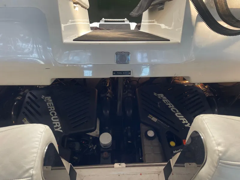 Slide: The Image of Engine compartment of a 2004 Cobalt 360 boat with Mercury engines visible. - 26