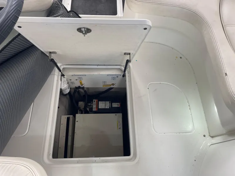Slide: The Image of Open hatch on 2004 Cobalt 360 boat revealing interior storage compartment. - 30