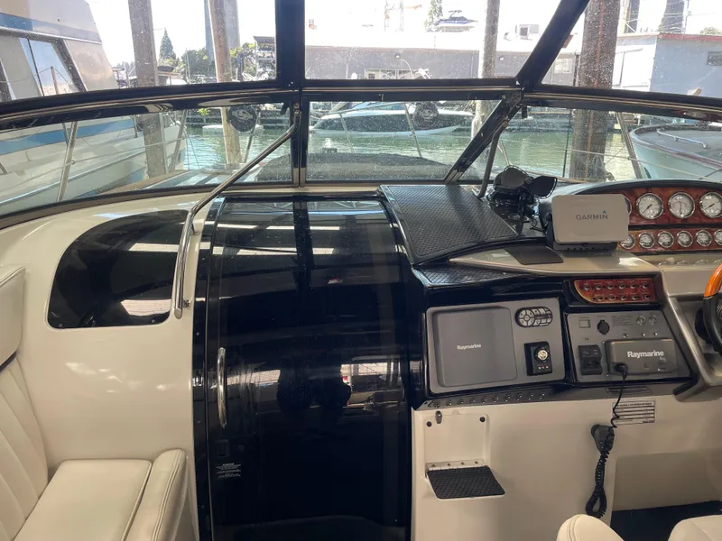 Slide: The Image of Cockpit of 2004 Cobalt 360 boat with Garmin and Raymarine navigation systems. - 32