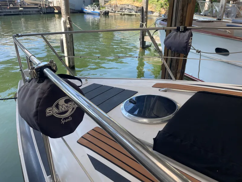 Slide: The Image of 2004 Cobalt 360 boat deck with Samson Sports accessories, docked by the water. - 36