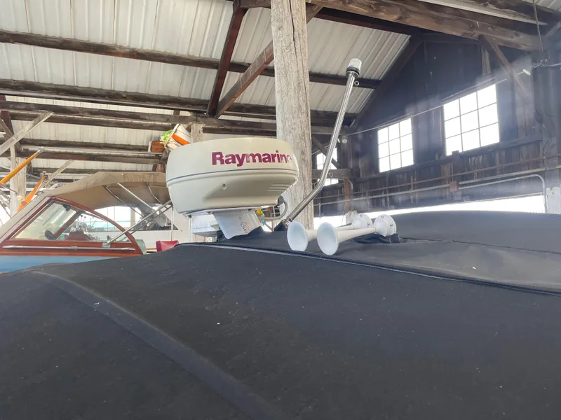 Slide: The Image of 2004 Cobalt 360 boat with Raymarine radar in a wooden boathouse. - 38