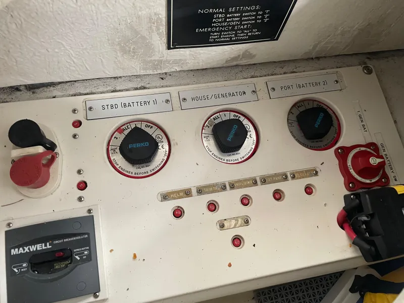 Slide: The Image of Control panel of a 2004 Cobalt 360 boat with battery switches and circuit breakers. - 39