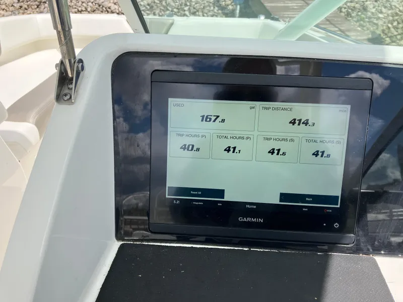 Slide: The Image of Garmin display on 2022 World Cat 230 SD boat showing speed and trip data. - 25