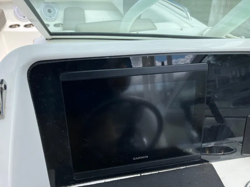 Slide: The Image of Garmin display on 2022 World Cat 230 SD boat dashboard. - 26