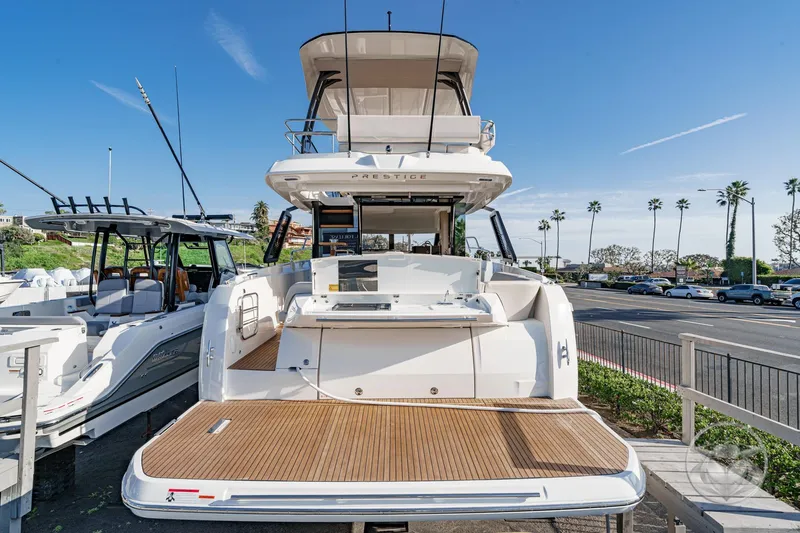 Slide: The Image of 2026 Prestige F4.3 yacht docked, showcasing spacious deck and modern design. - 19