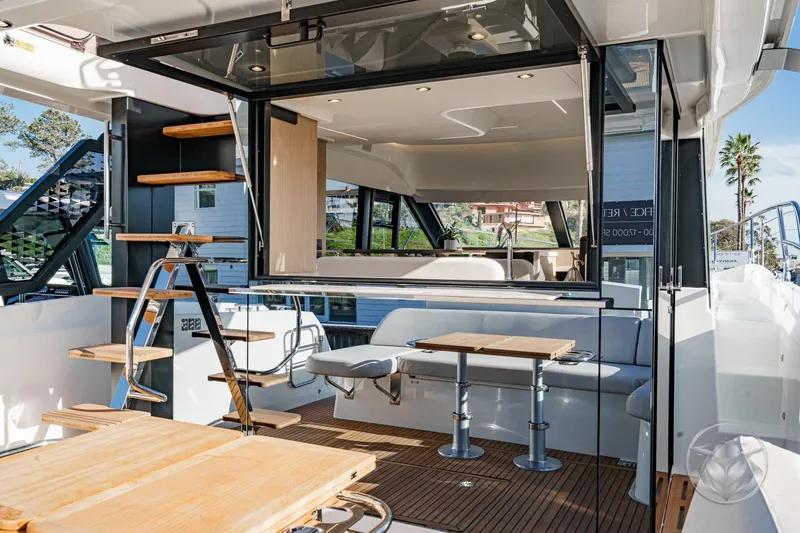 Slide: The Image of Modern Prestige F4.3 yacht interior with sleek design, wooden accents, and outdoor seating, 2026 model. - 22