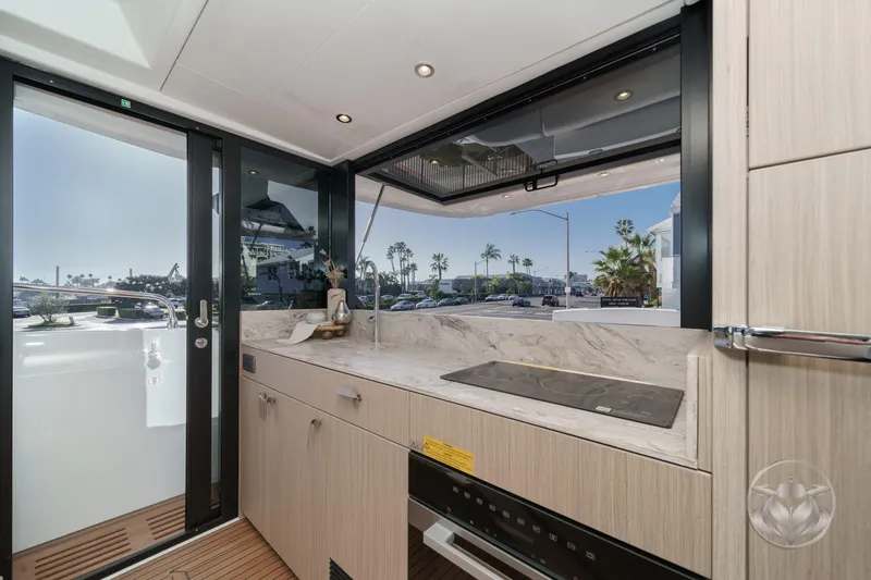 Slide: The Image of Modern kitchen interior on Prestige F4.3 yacht, featuring sleek design and scenic views, 2026 model. - 24