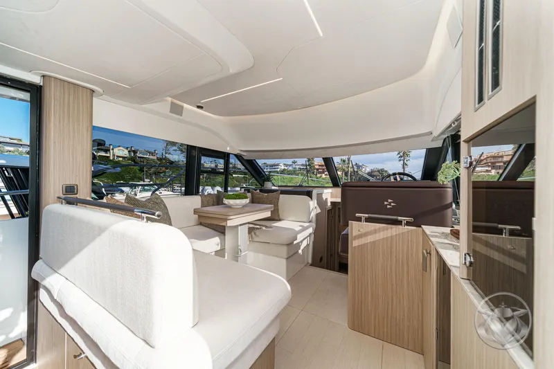 Slide: The Image of Luxurious interior of 2026 Prestige F4.3 yacht with modern seating and panoramic windows. - 25