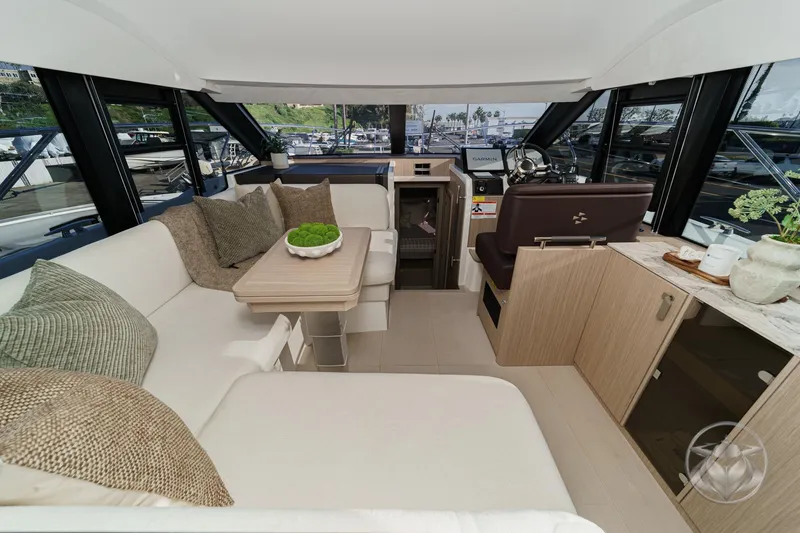 Slide: The Image of Luxurious interior of 2026 Prestige F4.3 yacht with elegant seating and modern helm station. - 29
