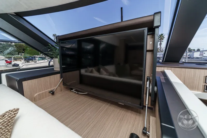 Slide: The Image of Luxurious interior of 2026 Prestige F4.3 yacht with modern TV setup. - 31