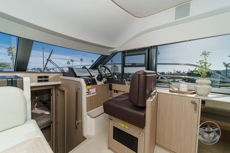 Slide: The Image of Luxurious interior of 2026 Prestige F4.3 yacht with modern helm and panoramic windows. - 32