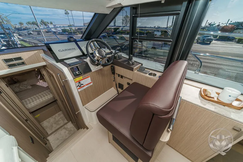 Slide: The Image of Interior of 2026 Prestige F4.3 yacht with modern helm and luxurious seating. - 33