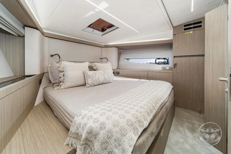 Slide: The Image of Luxurious cabin interior of 2026 Prestige F4.3 yacht with elegant bedding and modern design. - 34
