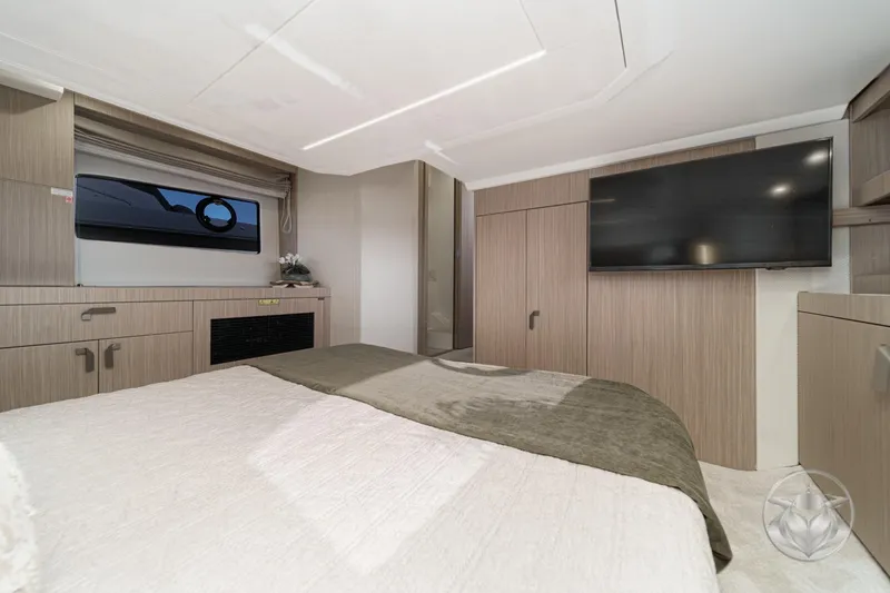 Slide: The Image of Luxurious interior of 2026 Prestige F4.3 yacht bedroom with modern furnishings and large TV. - 41