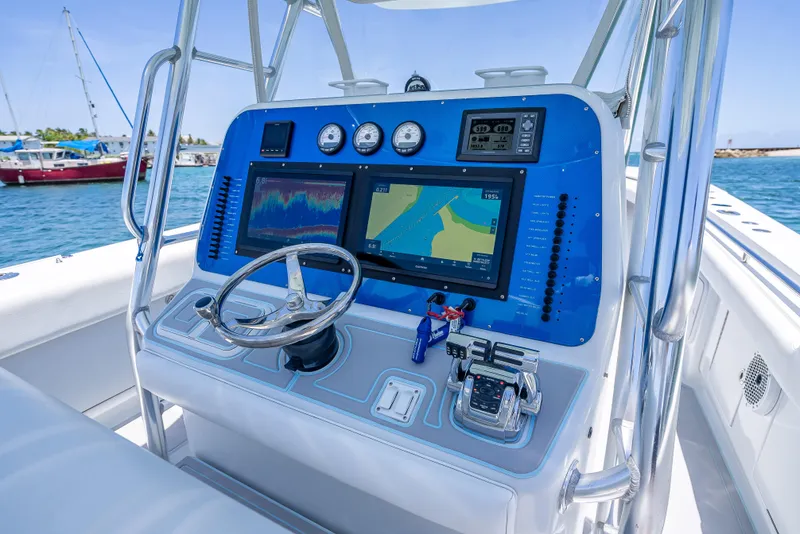 Slide: The Image of Control panel of a 2011 Revenge 35LT boat with navigation screens and gauges. - 20