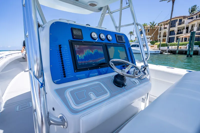 Slide: The Image of Control panel of a 2011 Revenge 35LT boat with navigation equipment. - 21