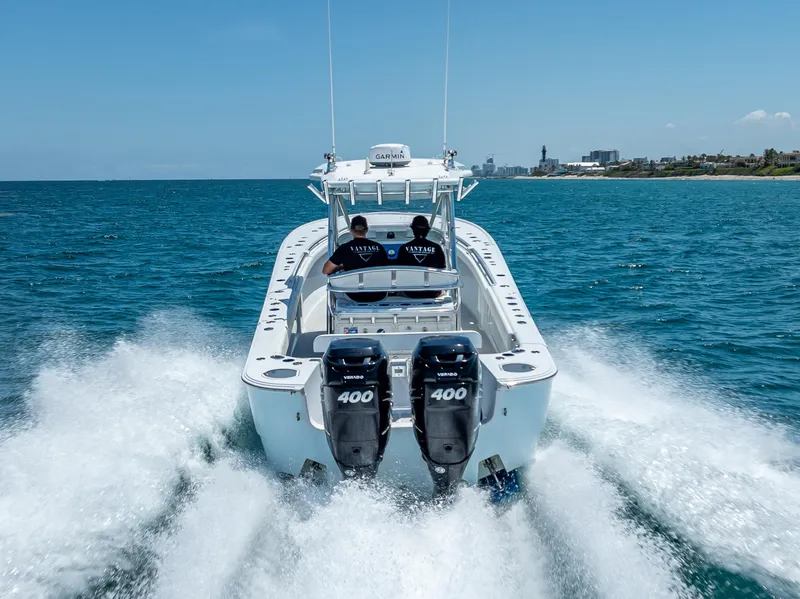 Slide: The Image of 2011 Revenge 35LT boat speeding on ocean with twin 400 horsepower engines. - 3