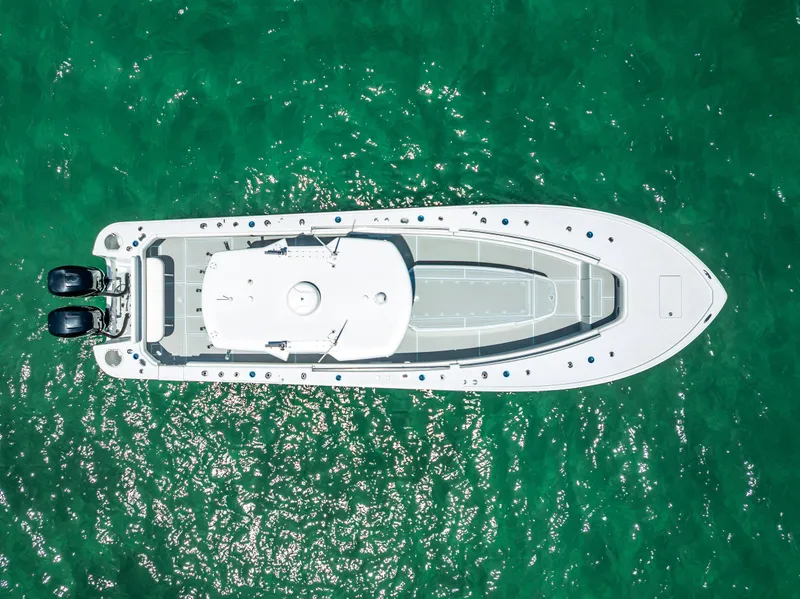 Slide: The Image of Aerial view of 2011 Revenge 35LT boat on clear turquoise water. - 4