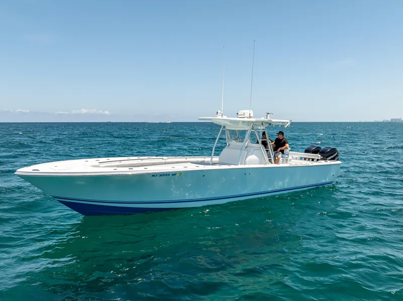 Slide: The Image of 2011 Revenge 35LT boat on open sea with clear blue skies. - 5