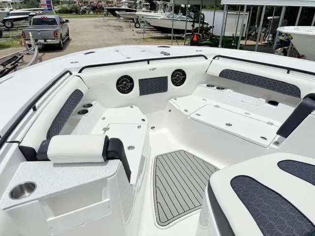 Slide: The Image of 2026 Tidewater 302 CC Adventure boat interior with cushioned seating and modern design. - 10